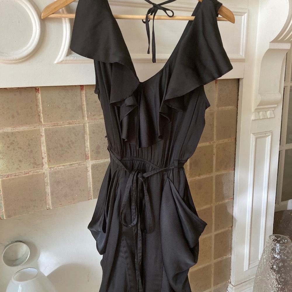 Naked Zebra black dress a wardrobe essential with softly draped pockets